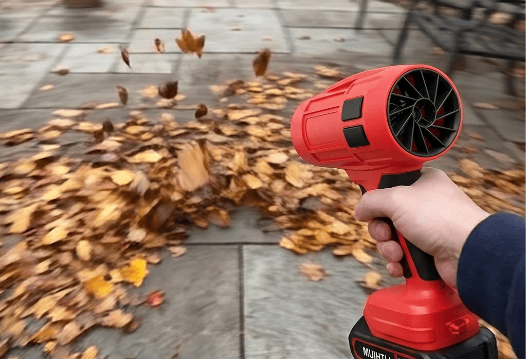 Cordless Wood Ranger blower clearing leaves outdoors